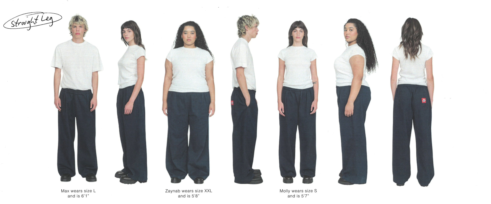 Line up of 7 people, mixed genders, against a white backdrop. All our wearing the same pair of navy Kev pants. 