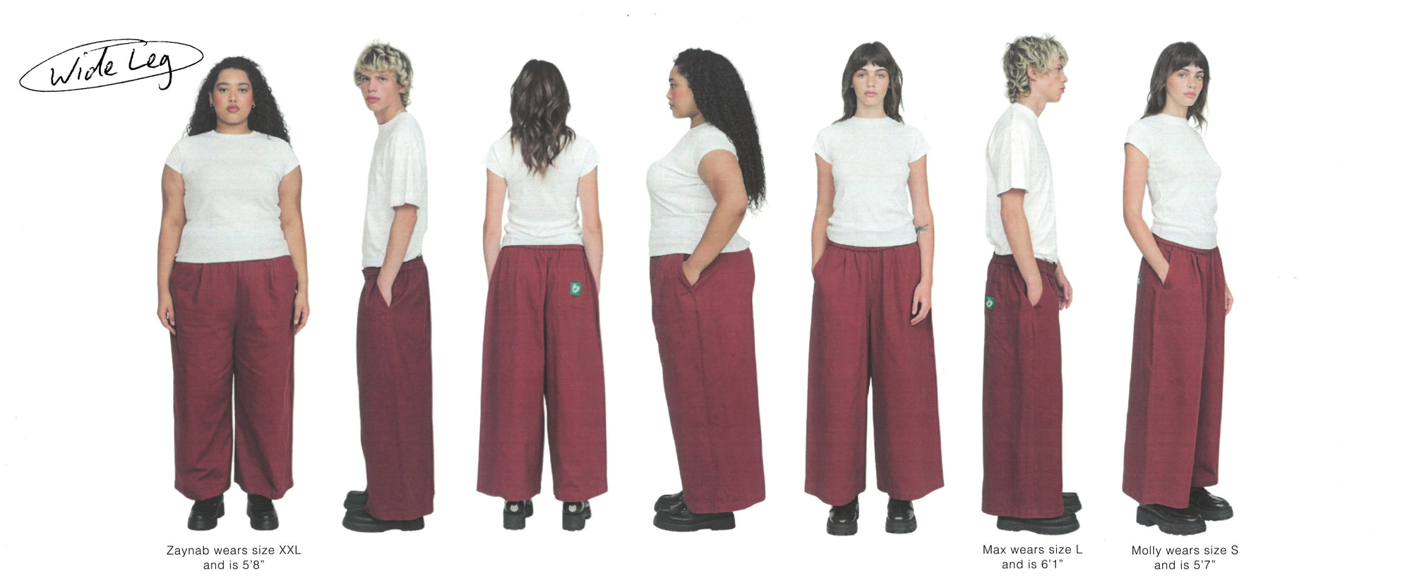 Line up of 7 people, mixed genders, against a white backdrop. All our wearing the same pair of burgundy Trev pants. 
